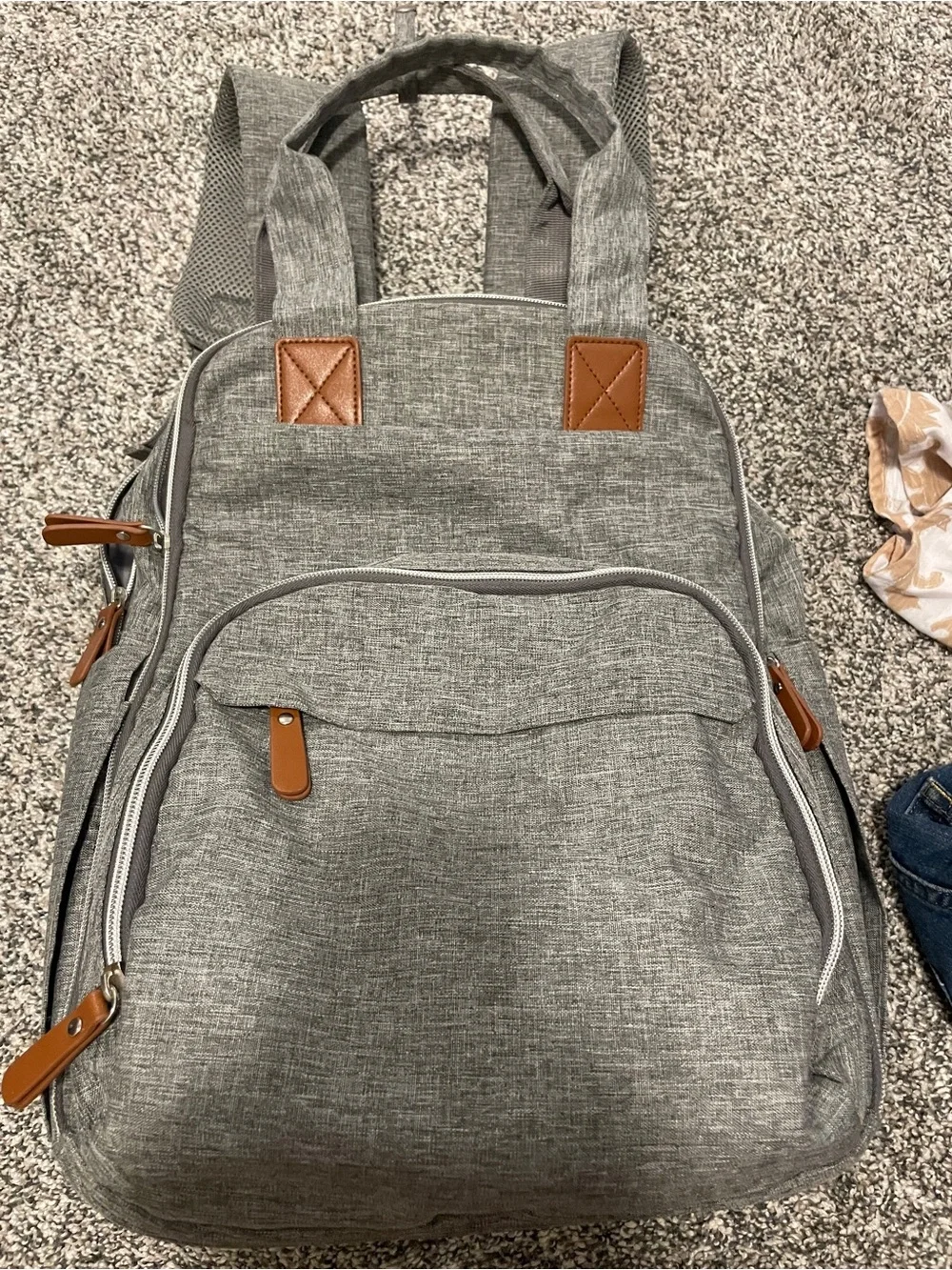 Gray backpack diaper bag with changing pad